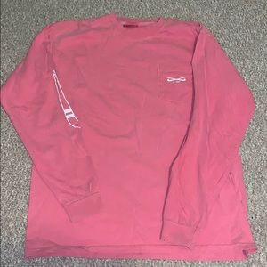 A pink long sleeve field hockey shirt